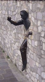 Jean Marais' statue of Marcel Aymé as 'Le Passe Muraille' in Place Marcel Aymé in Montmartre, Paris'